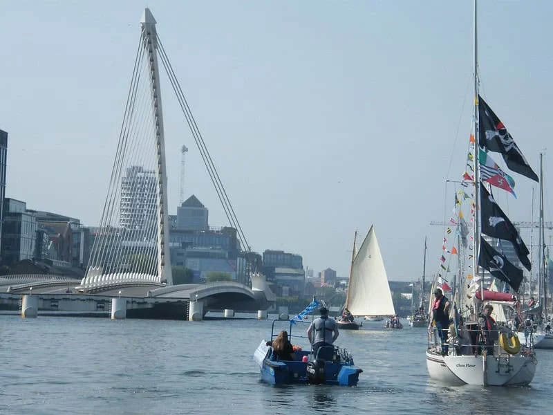 Samuel Becket bridge open for boats with yachts in front