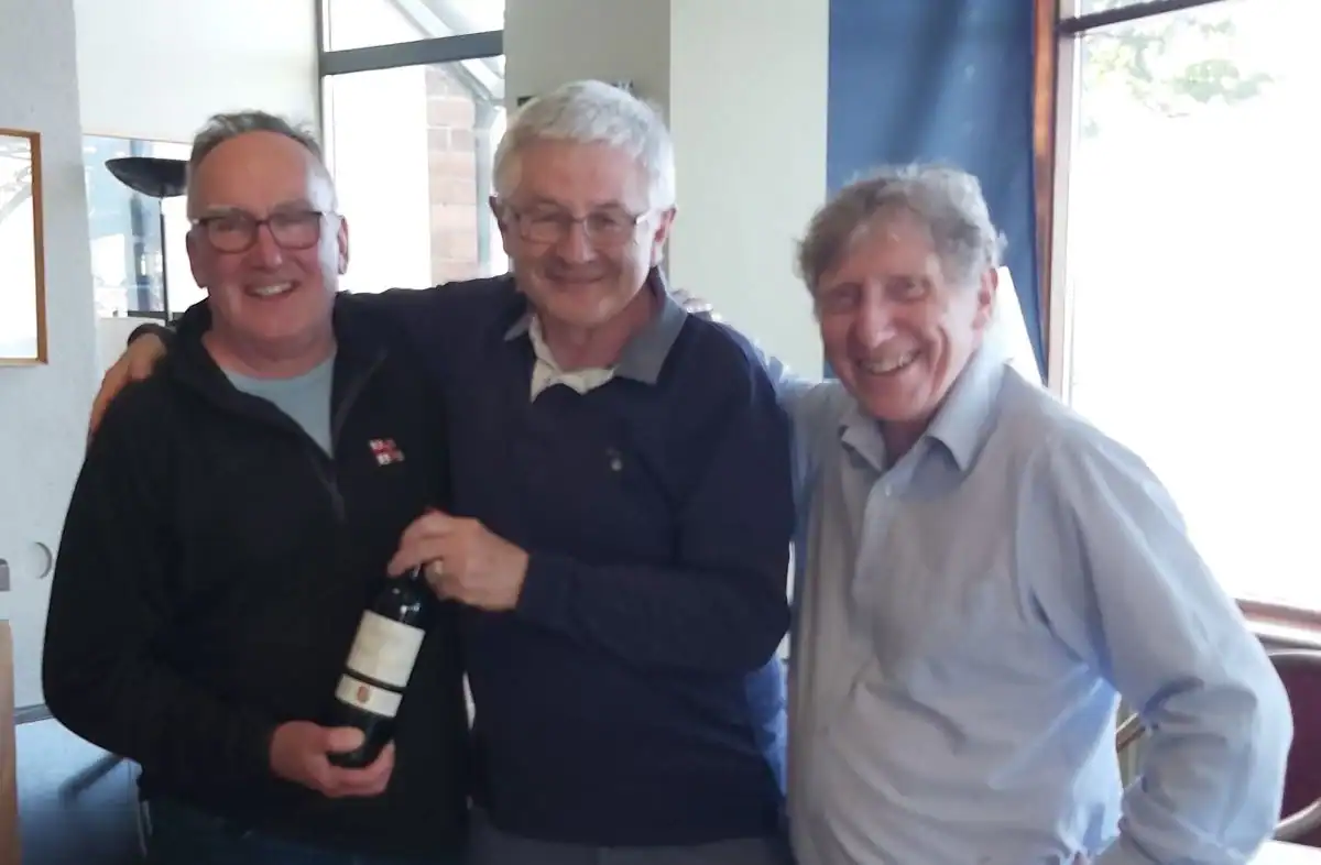 Colm Fitzpatrick, John Murphy and Vincent Lundy as a bottle of wine is presented