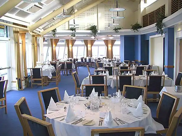 Dining room with tables set for dinner