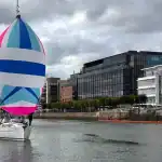 A yacht under spinnaker in the River Liffey